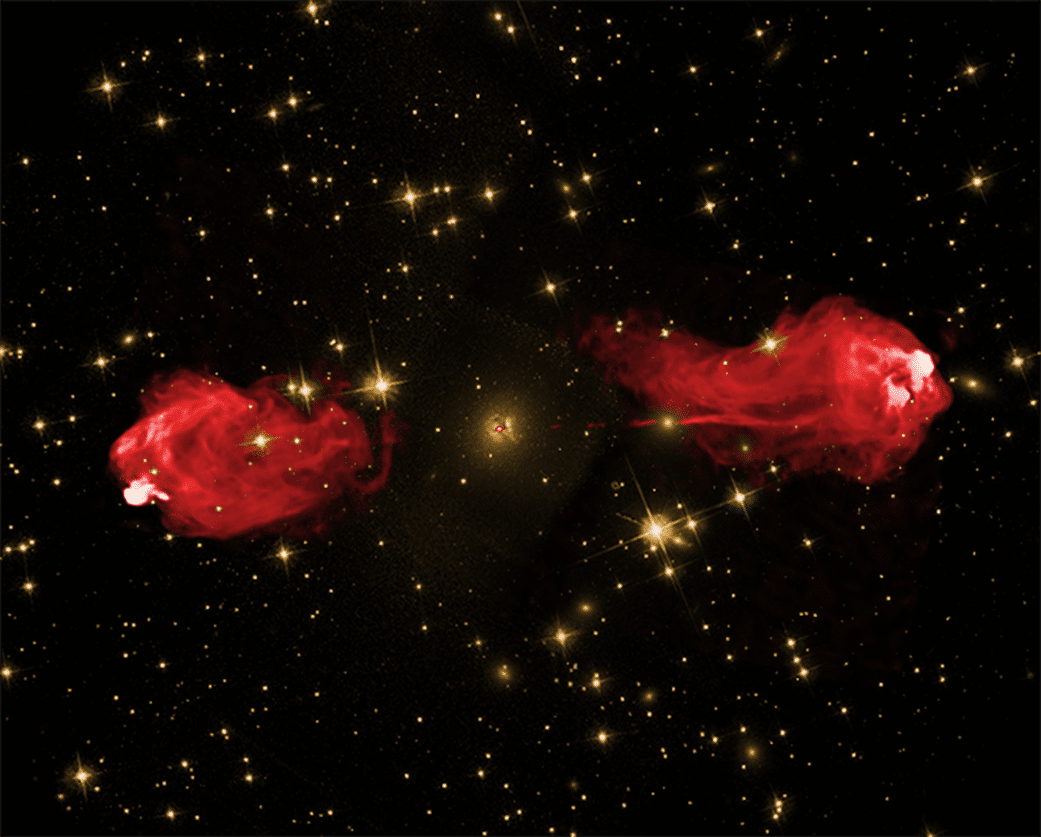 Due immagini di Cygnus A sovrapposte l'una sull'altra per mostrare i getti della galassia che emettono luce con le radiazioni radio (mostrate in rosso).Le galassie inattive, come la nostra Via Lattea, non hanno getti come questo, che possono essere legati