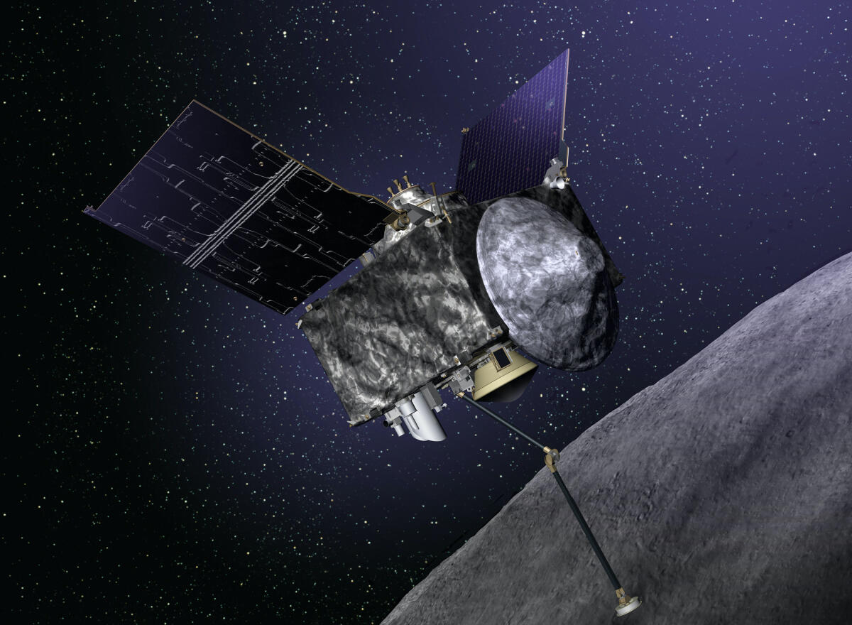 Asteroide Bennu: strana espulsione di particelle - Credits: media.inaf.it.
Illustration of OSIRIS-REx spacecraft at Bennu.