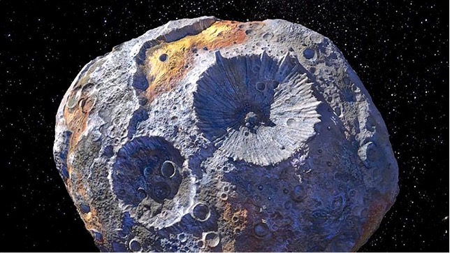 Rappresentazione artistica dell’asteroide 16 Psyche, il quale si stima contenga una quantità di minerali che viene stimata intorno ai 700∙10^30 $. Credits: thenationalnews.com