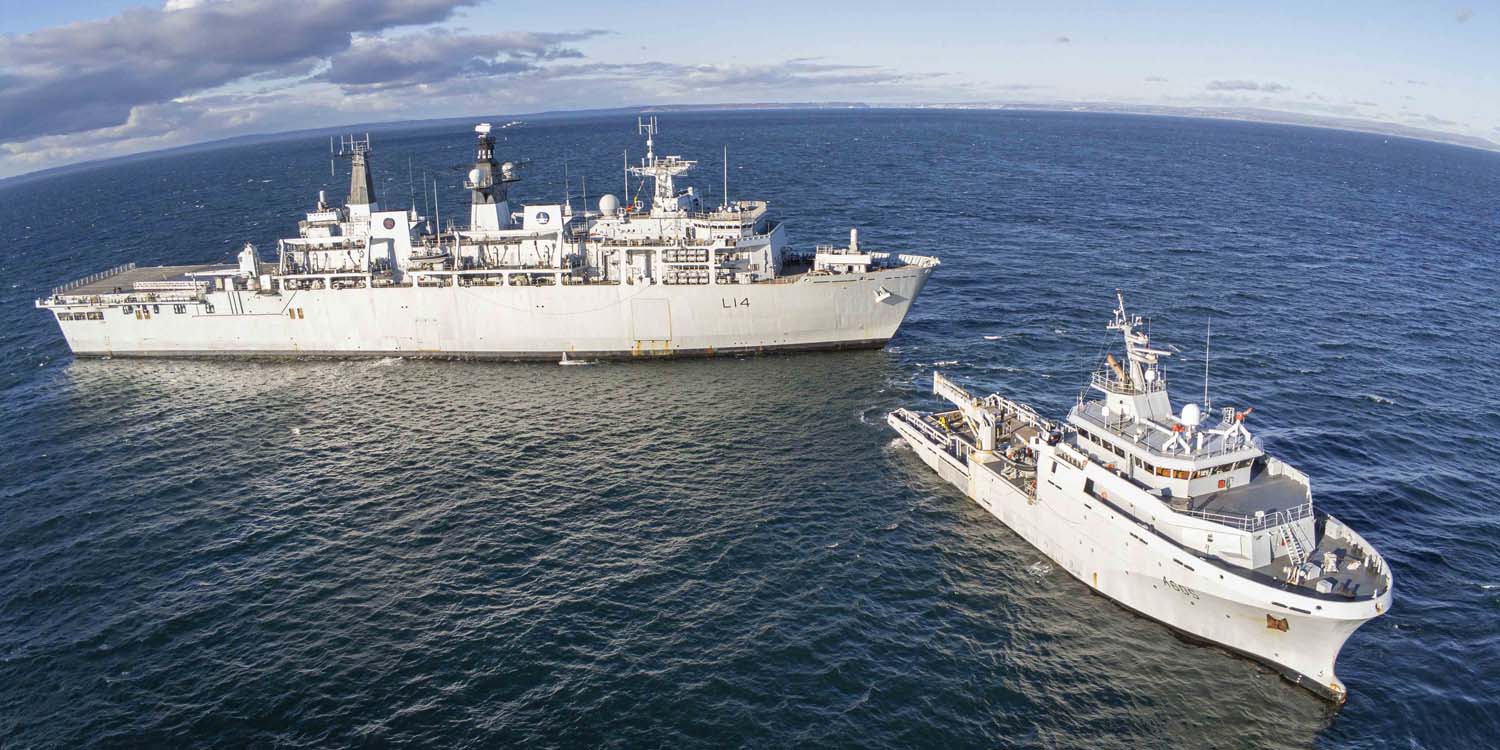 One of Britain’s biggest warships was towed through the Channel to help the French test the power of a new specialist ship.