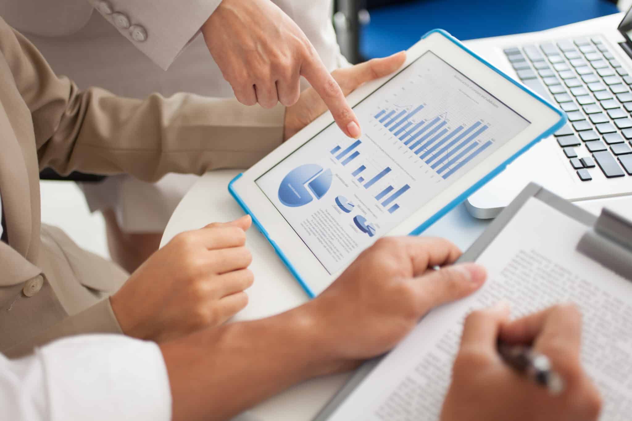 Group of analysts working on digital data to forecast next strategic movement