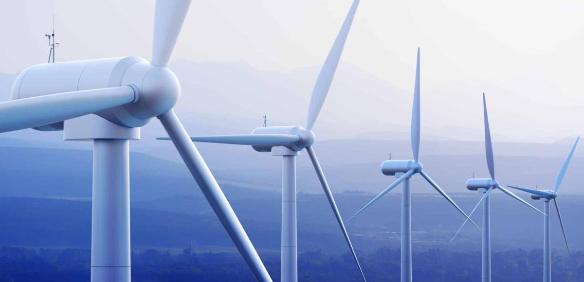 Pale eoliche: da energia green a rifiuti irrecuperabili? - Wind turbine farm against distant mountains (3d graphic)