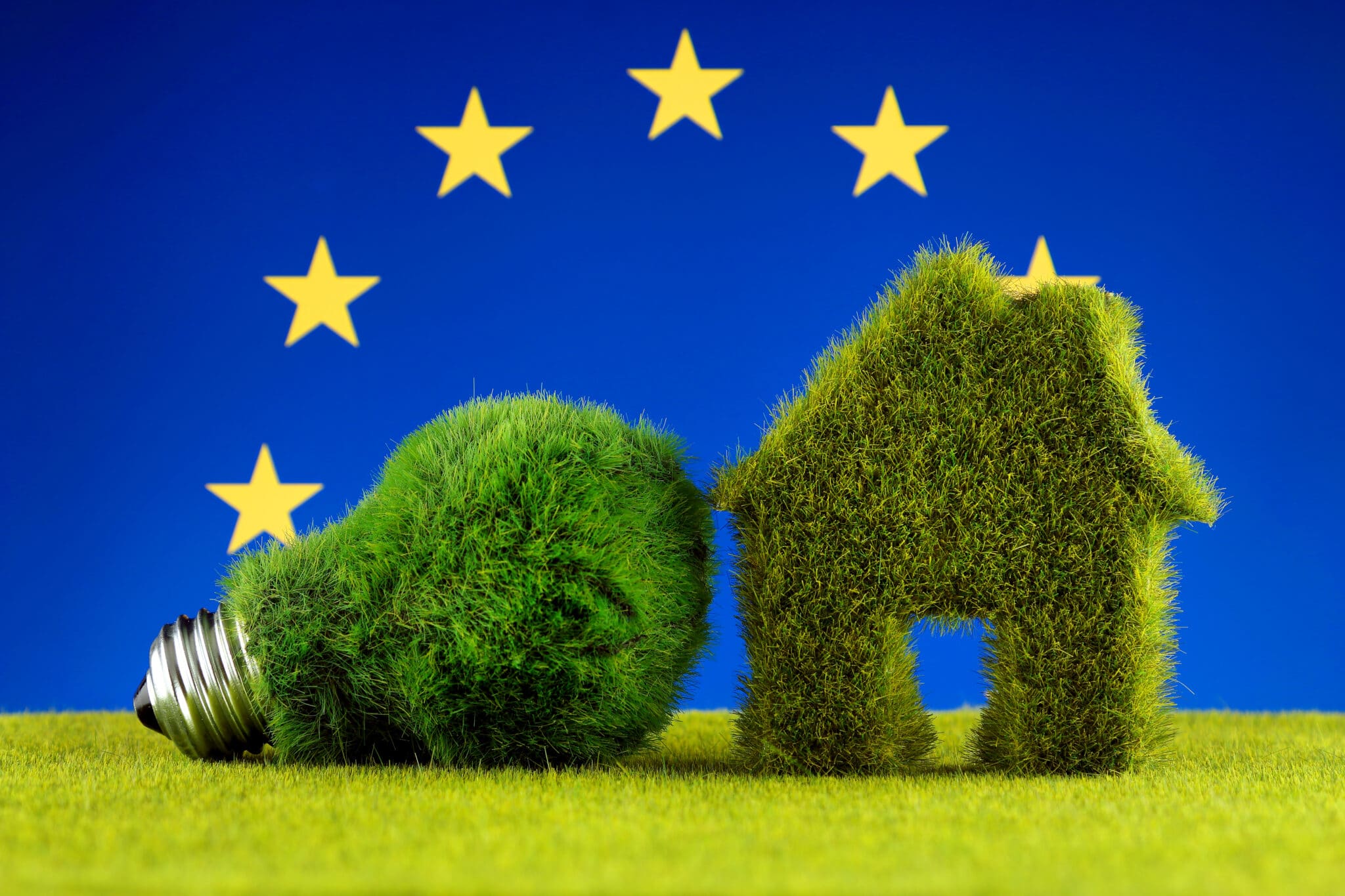 Green eco light bulb, eco house icon and European Union Flag. Renewable energy. Electricity prices, energy saving in the household.