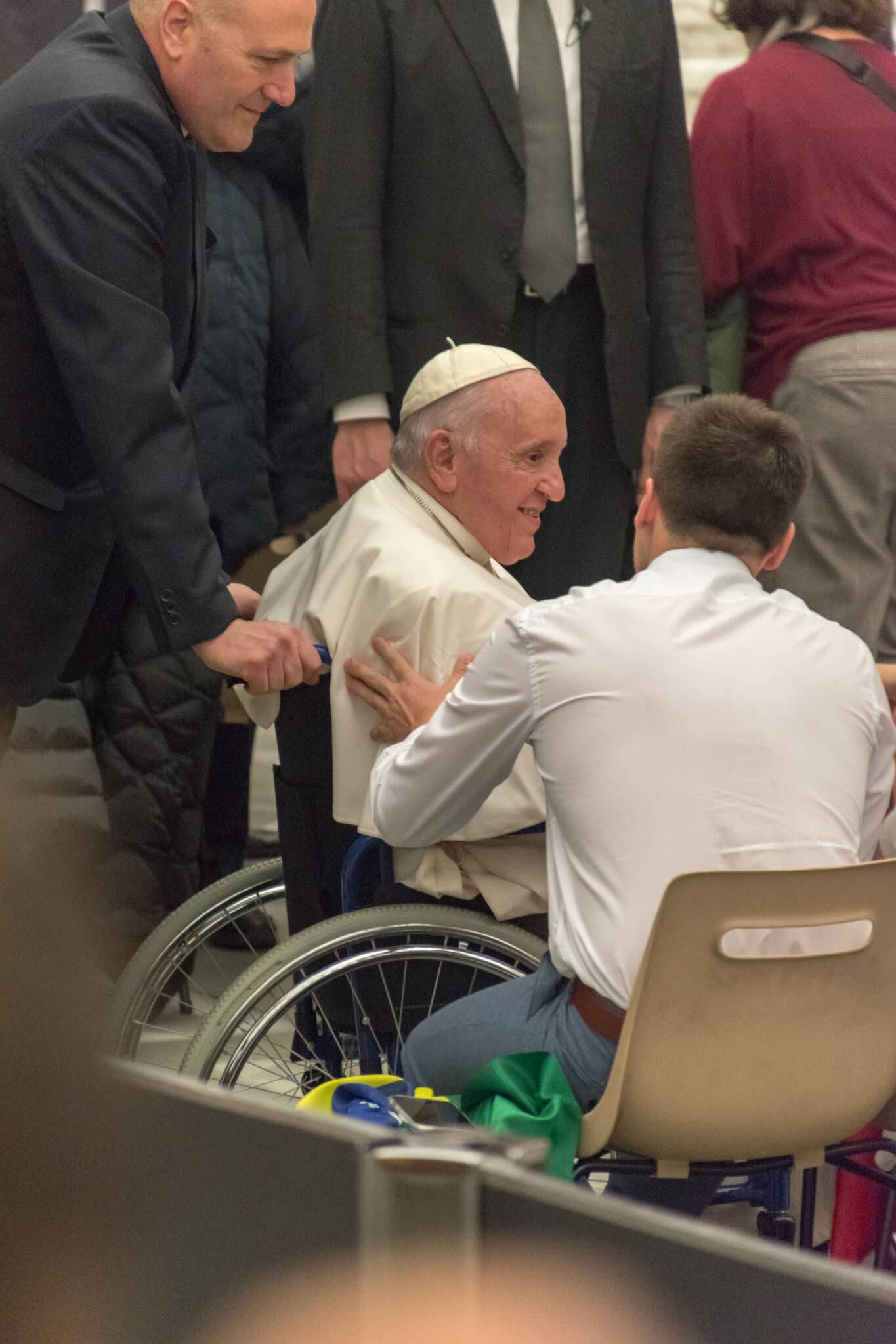 Vatican City, Vatican - December 7, 2022: Pope Francis (Jorge Mario Bergoglio) on wheelchair on Papal Audience in the Paul VI hall.