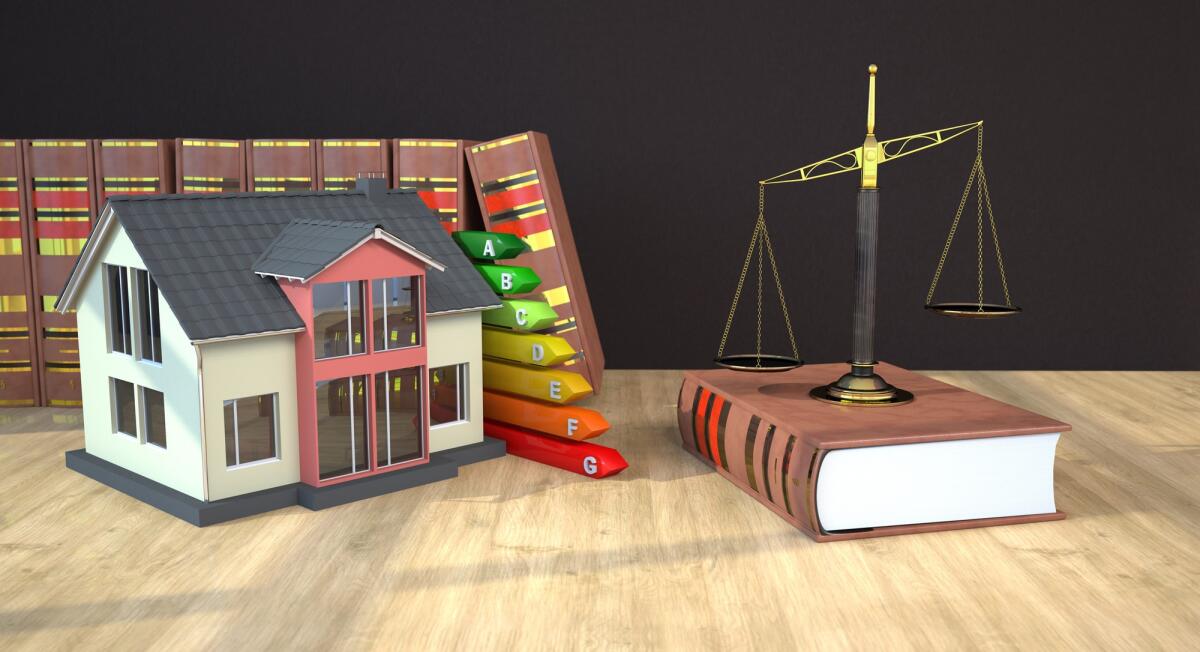 A.P.E. cosa è e a che serve - House with energy pass, beam scale and law books on the table. 3d illustration.
