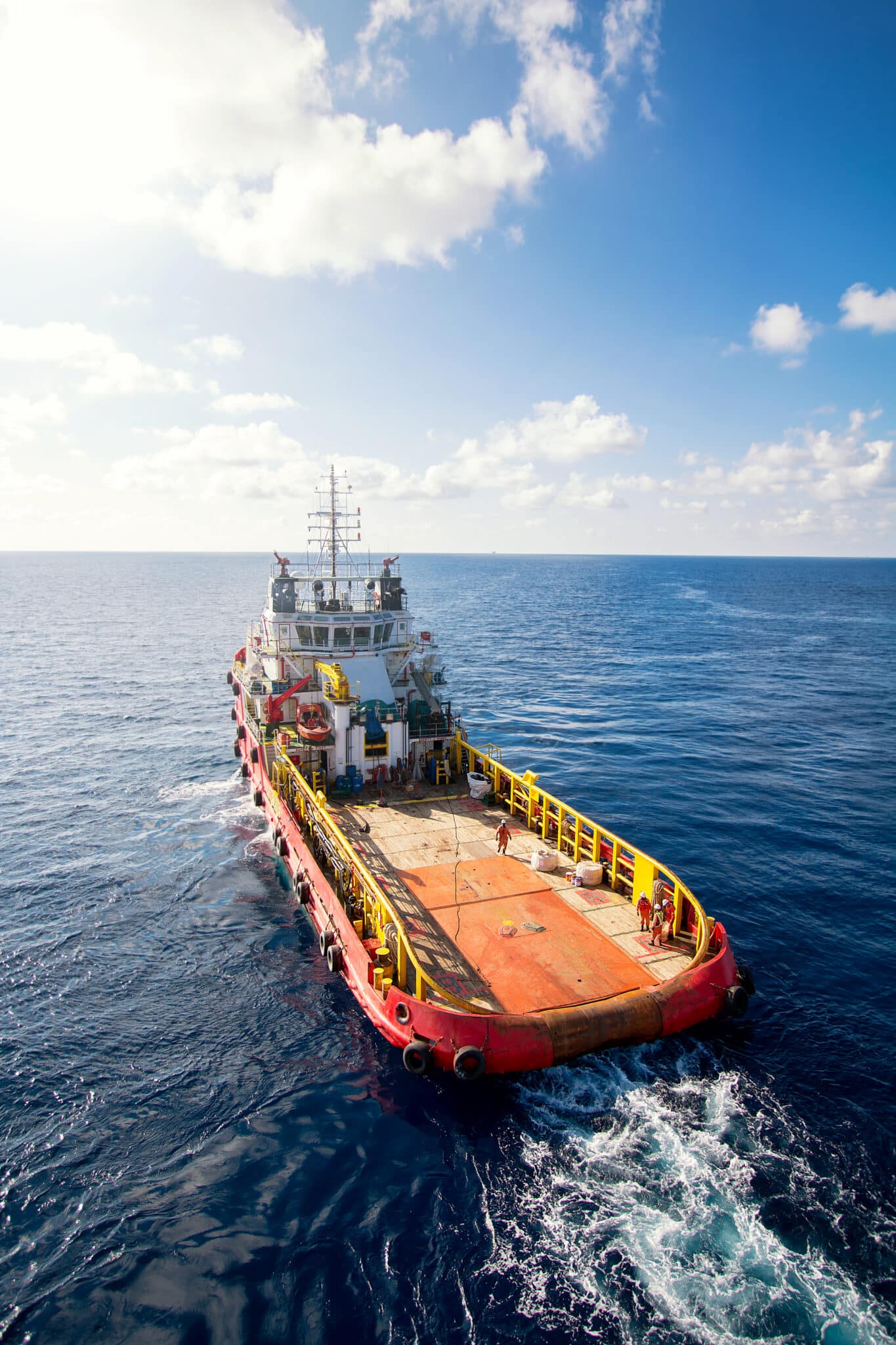 Supply boat or crew boat transfer cargo to oil and gas industry and moving cargo from the boat to the platform, boat waiting transfer cargo and passenger between oil and gas platform for hard work in offshore.