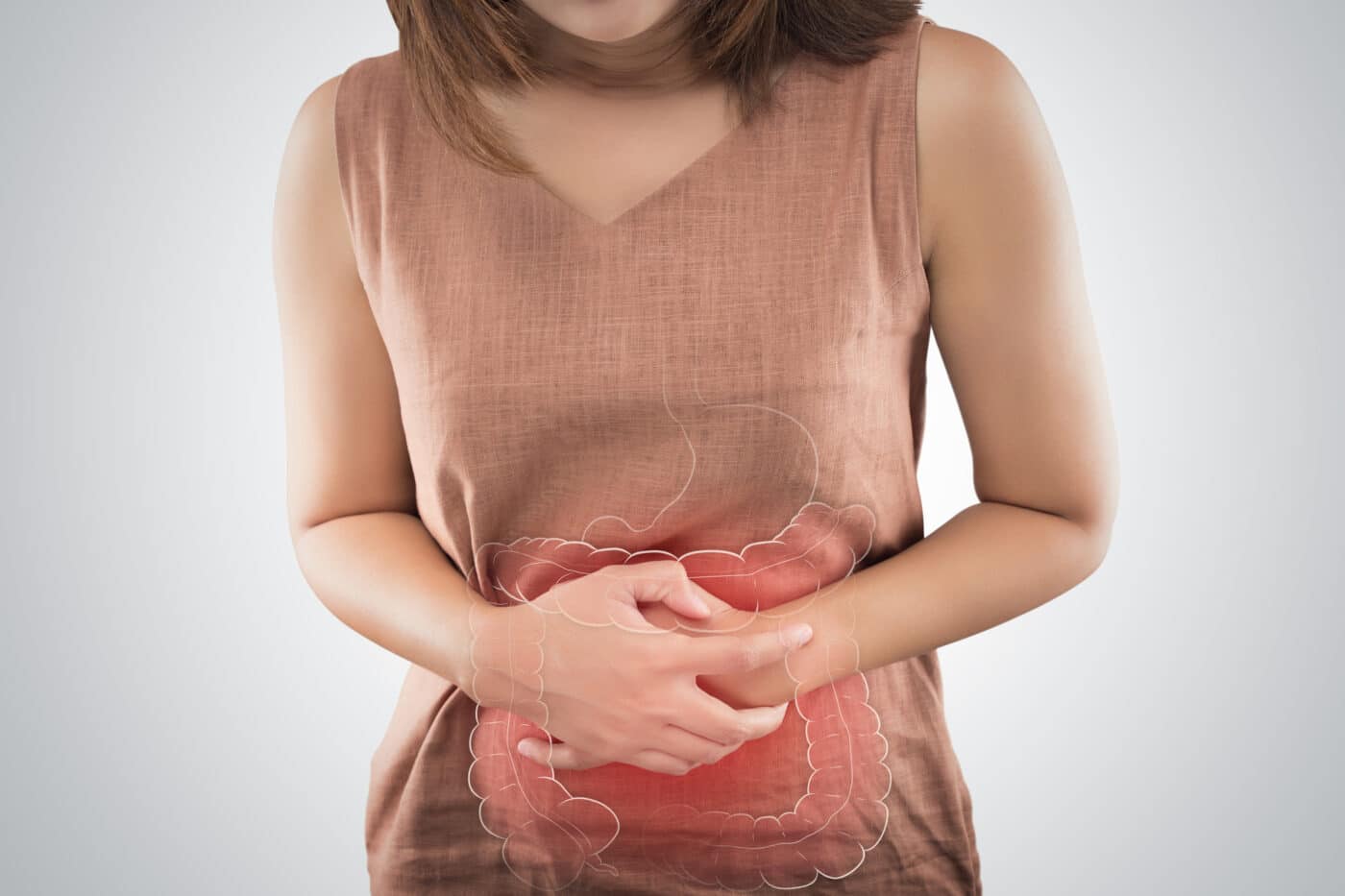 The Photo Of Large Intestine Is On The Woman's Body. People With Stomach Ache Problem Concept. Female Anatomy