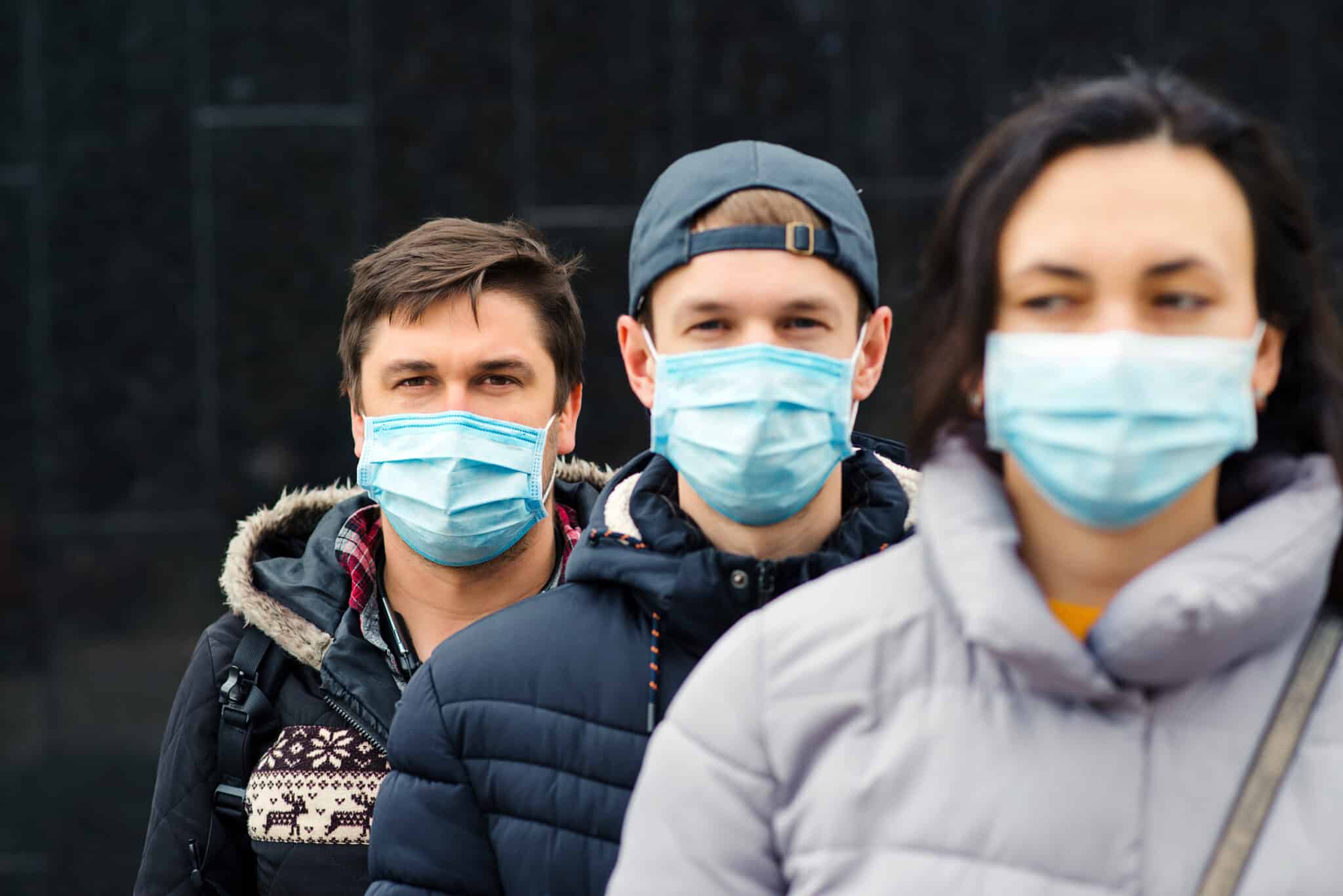 Crowd of people wearing medical masks. Coronavirus epidemic concept. Group of young volunteers outdoors. Coronavirus quarantine. Global pandemic. Worldwide coronavirus outbreak.