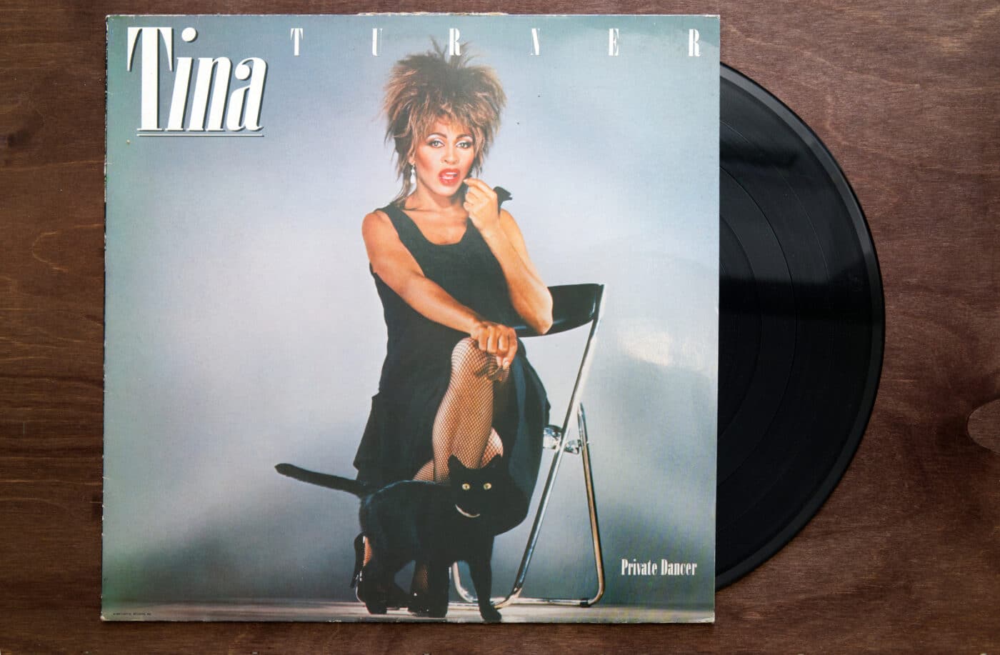 Lublin, Poland. 18 January 2023. Tina Turner "Private Dancer" vinyl album cover on dark wooden table