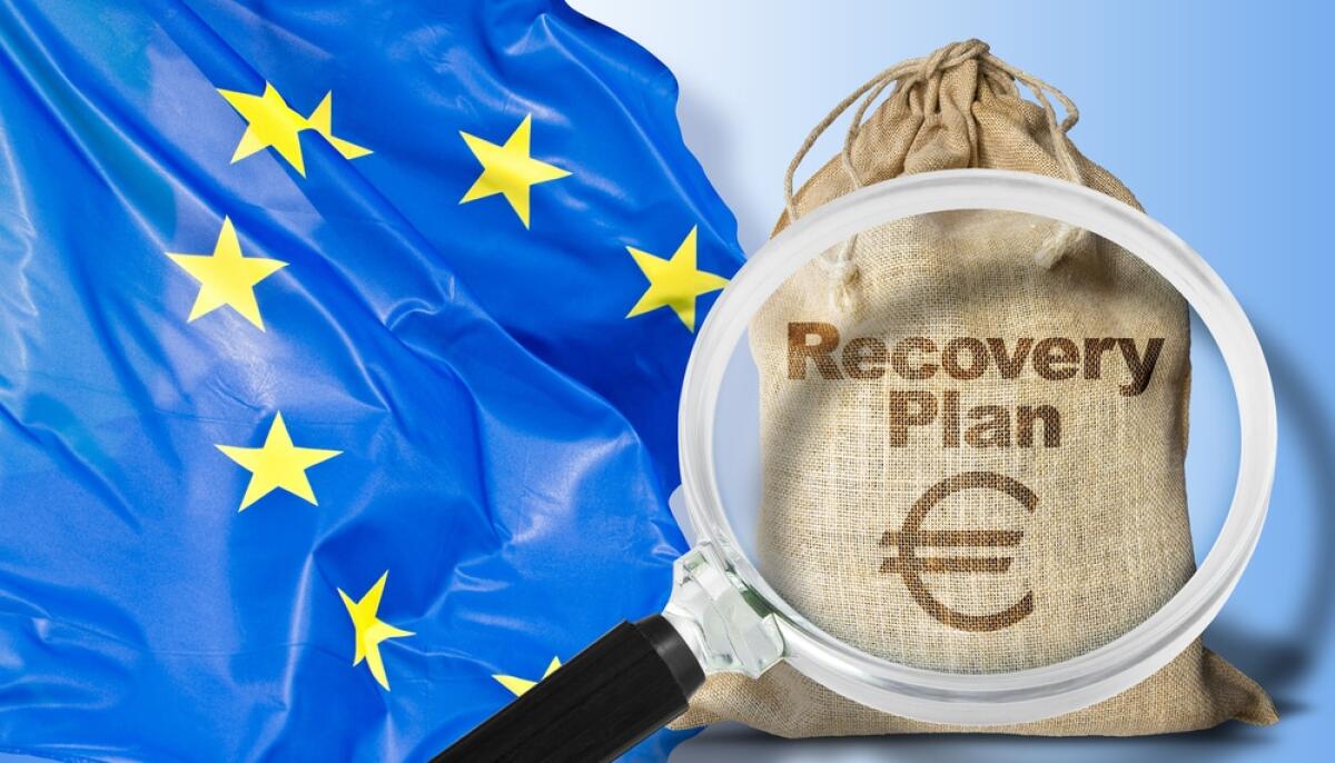 PNRR: cos'è, obiettivi raggiunti e sfide - Doubts and uncertainties about the European Recovery and Resilience Plan against the crisis of the Covid virus pandemic - concept with european flag, jute bag of money and question mark