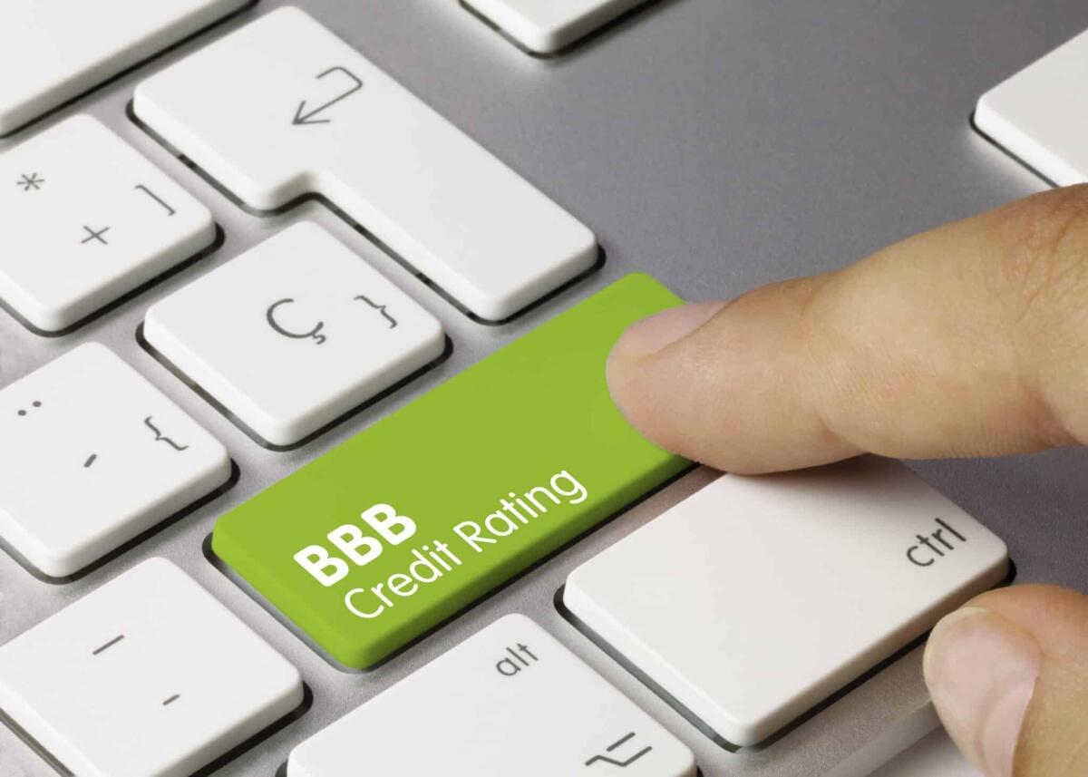 Standard & Poor's conferma rating stabile per l'Italia: BBB - BBB Credit rating Written on Green Key of Metallic Keyboard. Finger pressing key.