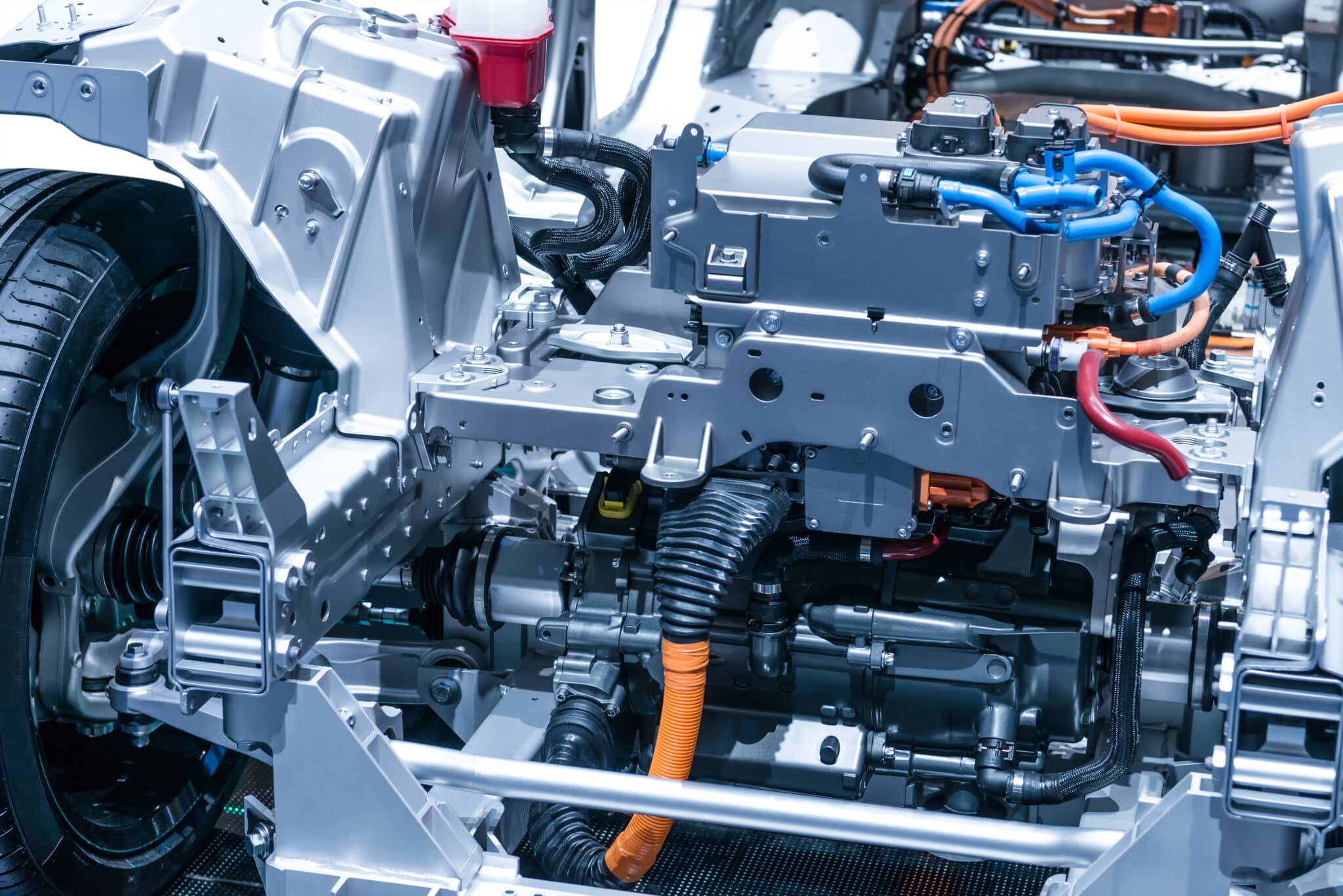 Chassis of the electric car with powertrain and power connections closeup.