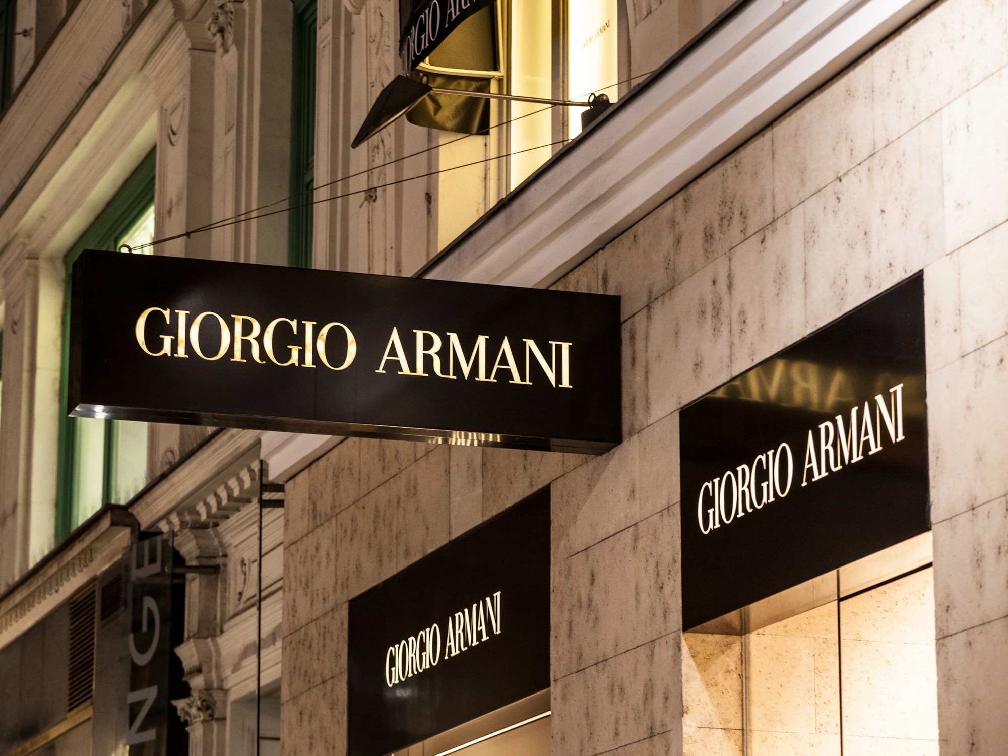 VIENNA, AUSTRIA - NOVEMBER 6, 2019: Giorgio Armani logo in front of their boutique for Vienna. Giorgio Armani is an Italian luxury fashion designer & manufacturer producing clothing and accessories.Picture of a sign with the logo of Giorgio armani on thei
