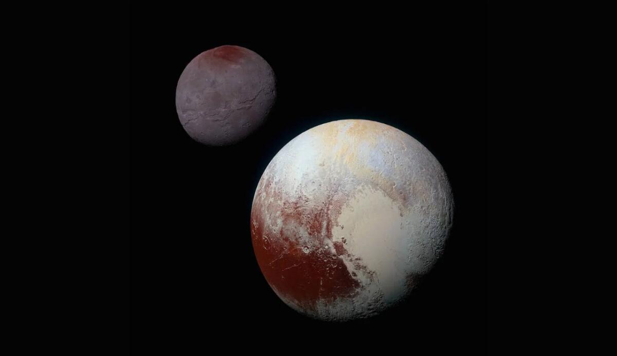 Ora sappiamo come ha fatto Plutone a "catturare" Caronte - Plutone e Caronte (NASA Foto) - www.aerospacecue.it