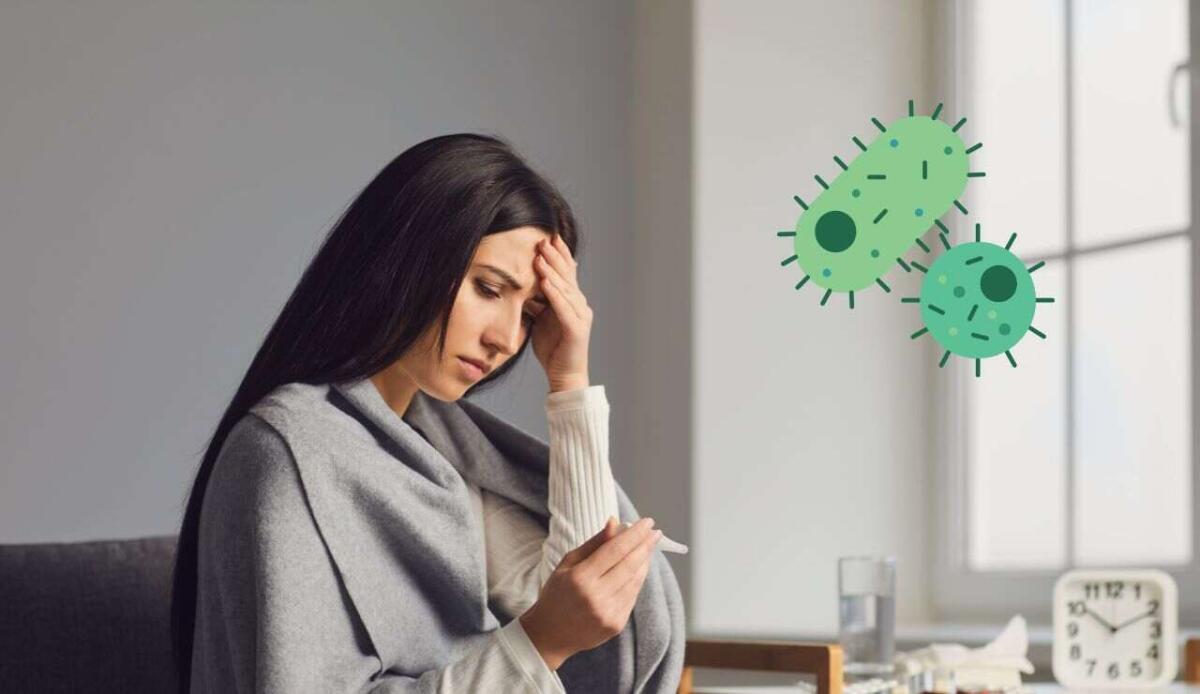 Perché ci viene la febbre? Ecco come il nostro organismo combatte virus e batteri - Donna con la febbre (Canva Foto) - www.biomedicalcue.it