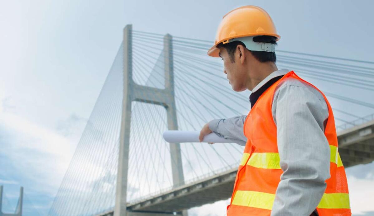Cina, inaugurato il ponte più alto del mondo: vola a 625 metri sopra il fiume Beipan - Illustrazione di un ponte in costruzione (Canva FOTO) - buildingcue.it