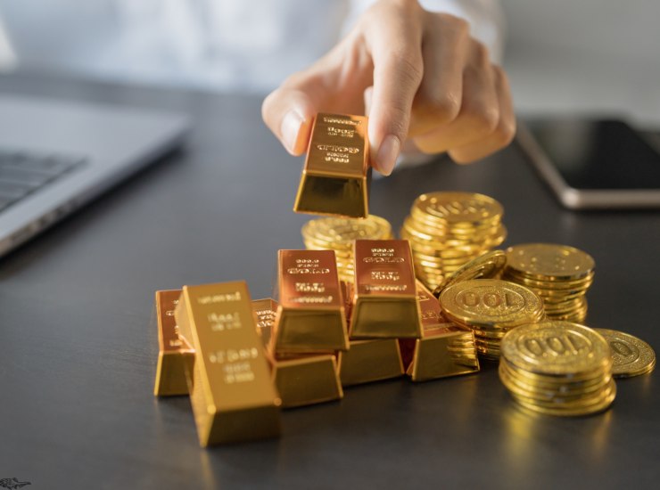 Illustrazione di alcuni lingotti d'oro (Canva FOTO) - financecue.it